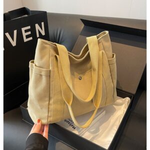 (Alt Text): High-end custom logo women's canvas tote bag, showcasing the overall look of beige canvas and brown leather shoulder straps, suitable for corporate gifts and brand promotions.